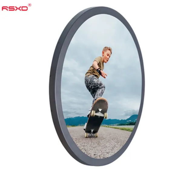 Round LCD screen displaying an image of a boy skateboarding